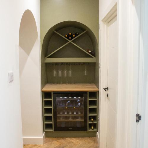 a walk in wine cellar with an archway in a room at The Cove Ocean Village in Southampton