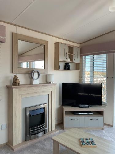 Televisyen dan/atau pusat hiburan di Thurston Manor Holiday Park, Dunbar