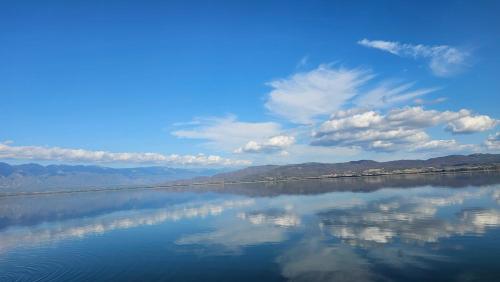 a large body of water with a blue sky and clouds at LAKE Dream 1 in Star Dojran