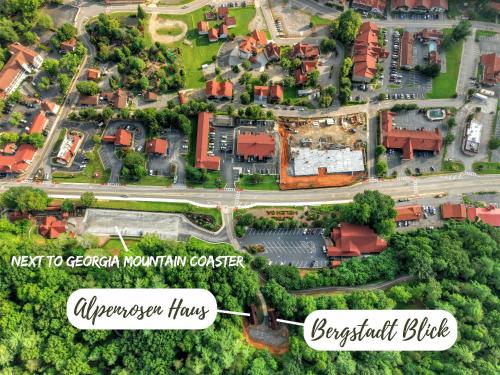 an aerial view of an apartment complex in a suburb at New Alpenrosen Haus-Arcade Hot Tub Sauna Views in Helen
