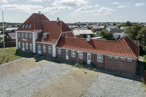 an aerial view of a large brick house at Hirtshals Gamle Station in Hirtshals