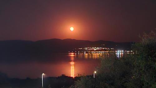 a sunset over a bridge over a body of water at Lake Dream NINO in Star Dojran