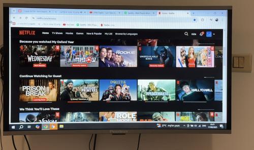 a television screen with a bunch of movies at Swita Nir - Hot tub, Beach & Barbeque in Ashdod
