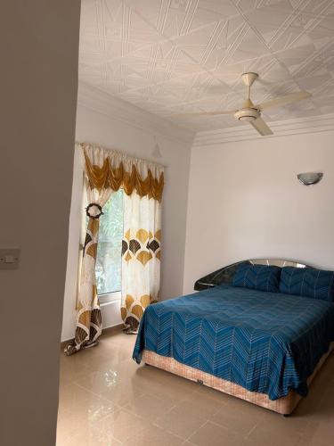 Postel nebo postele na pokoji v ubytování John Masarr Apartments