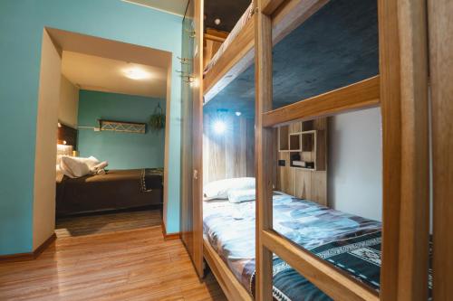 a bedroom with two bunk beds in a room at The Secret Garden in Quito