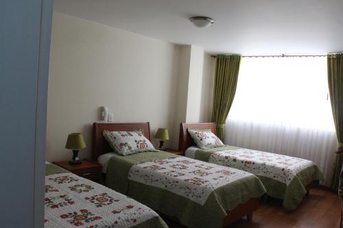 Postel nebo postele na pokoji v ubytování Hotel Castillo Real
