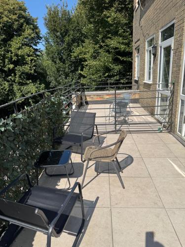 a group of chairs sitting on a patio at The Lanes Sunset Terrace in Brighton & Hove