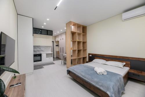 Postel nebo postele na pokoji v ubytování Квартира рядом с Мегой и Арбатом