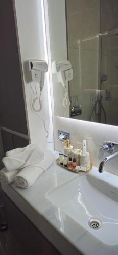 a bathroom counter with a sink and a mirror at SEA BREEZE Baku-FH in Baku