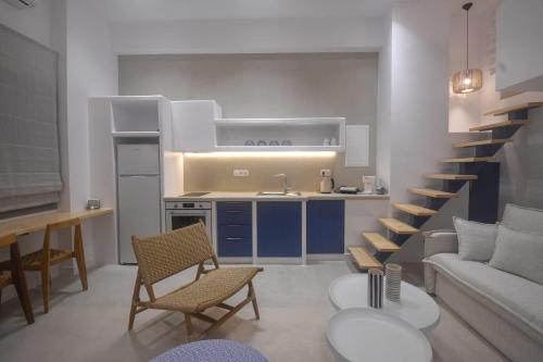 a kitchen and a living room with a couch and a table at Antara in Stení