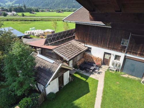 an aerial view of a house with a yard at Winklgut Bacher in Uttendorf
