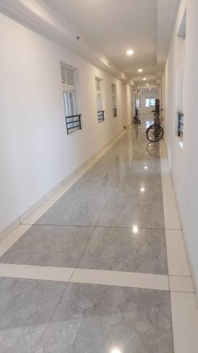 an empty hallway of a building with a bike in it at The Zenith Stay in Hyderabad