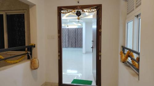 a mirror hanging on a wall in a room at The Zenith Stay in Hyderabad