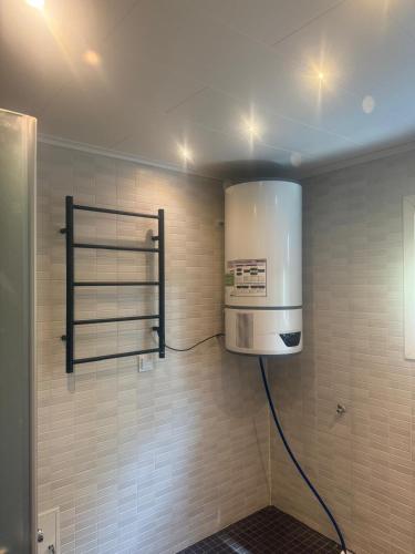 a kitchen with a stove and aperature at Guest house in Lyckeby in Karlskrona