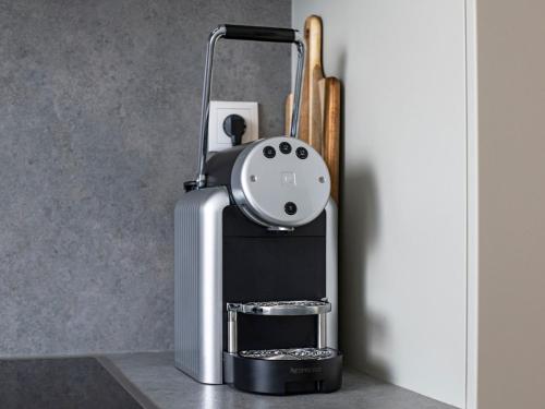 a coffee machine sitting on top of a counter at 75m2 Designer Apartment close to Bregenz in Lauterach