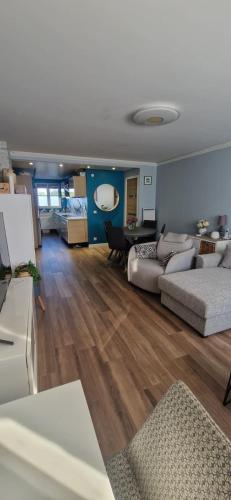 a large living room with two beds and a table at Appartement à Disney in Bailly-Romainvilliers