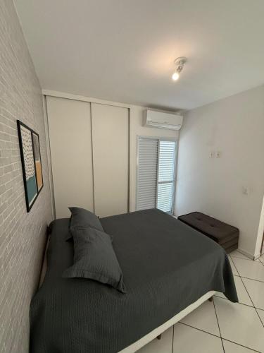 Katil atau katil-katil dalam bilik di Loft Aconchegante e Moderno