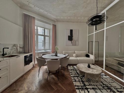 a living room with a couch and a table at La Belle Epoque in Warsaw