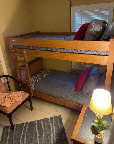 a room with two bunk beds and a chair at Southern Perk -Coffee & Caffeine in Crestview