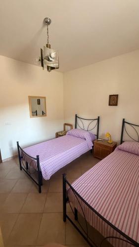 Postel nebo postele na pokoji v ubytování PM 56 Via Grande