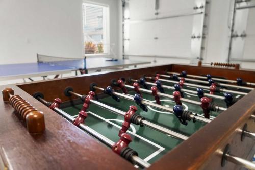 a billiard table with balls on it in a room at Heated Pool Elevator Game Room & Ocean Decks in Coquina Gables