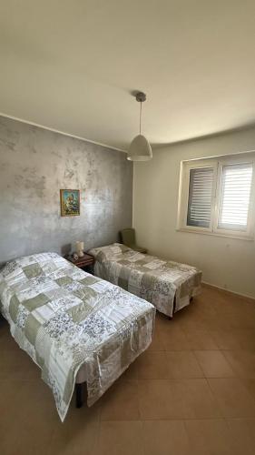 Postel nebo postele na pokoji v ubytování PM 56 Via Grande