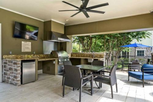 a kitchen and dining area with a table and chairs at Resort Style Apartment/Home - The Woodlands in The Woodlands
