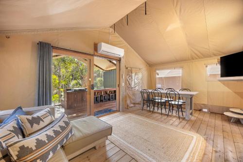 a living room with a couch and a table at BIG4 Yarra Valley Park Lane Holiday Park in Healesville