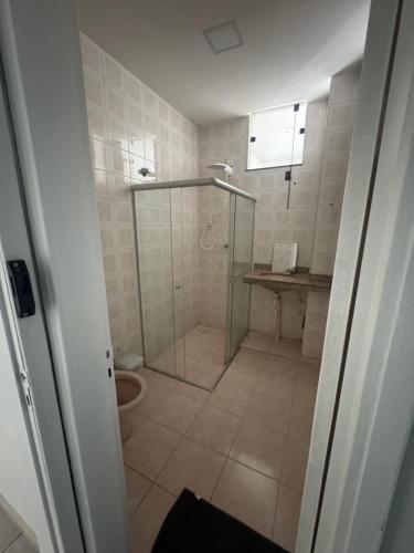 a bathroom with a shower and a toilet at Pousada 10 de maio in Itaperuna