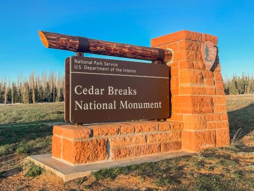 a sign for the cedar breaks national monument at The Hidden Moose in Brian Head