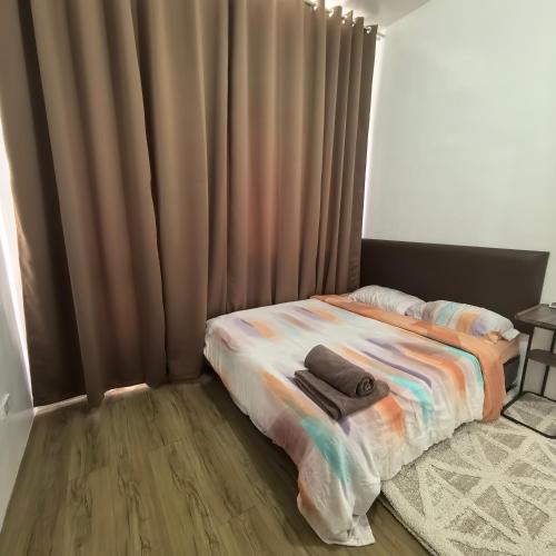 Postel nebo postele na pokoji v ubytování Davao City Airport Transient Rooms by Lemonique