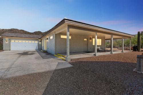 a house with a garage and a driveway at Scenic Desert Getaway in Marana Rest and Serenity in Marana