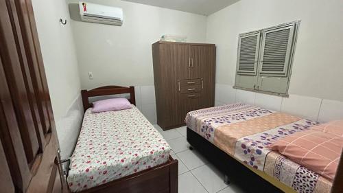 Postel nebo postele na pokoji v ubytování Casa de Temporadas Alto Bonito