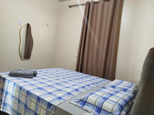 En eller flere senge i et værelse på Vivenda Paz do Jubim