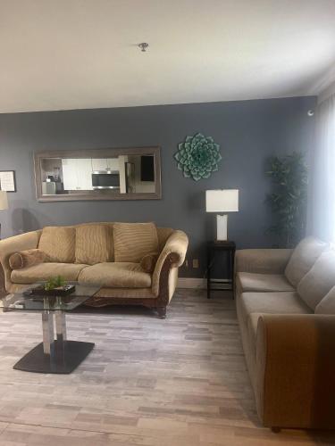 a living room with a couch and a table at Condo Disney Universal Epic Free Parking in Orlando