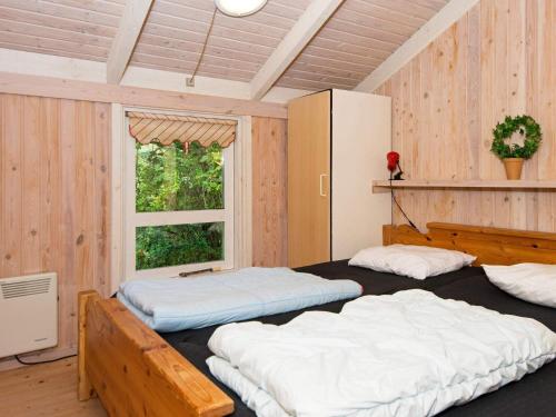 Ένα ή περισσότερα κρεβάτια σε δωμάτιο στο 6 person holiday home in Ebeltoft-By Traum