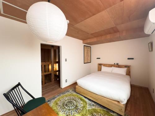Ένα ή περισσότερα κρεβάτια σε δωμάτιο στο The Cozy Nest Matsukawa