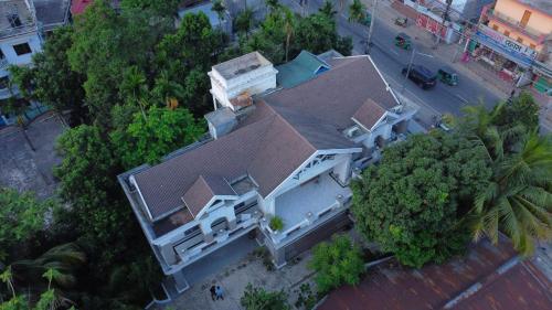 an overhead view of a house with a roof at Sylvan Premium Guest House in Sylhet