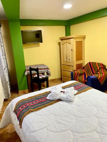 Ένα ή περισσότερα κρεβάτια σε δωμάτιο στο TORIBIANS Hotel