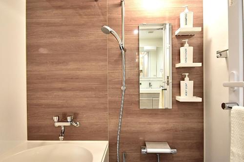 a bathroom with a shower with a toilet and a sink at LANG - Vacation STAY 22203v in Tokyo