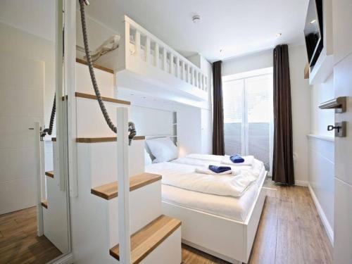 En eller flere senge i et værelse på Blanker Hans 03 - Ferienwohnung