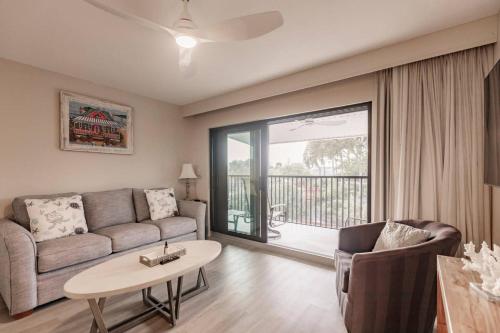 a living room with a couch and a table at Park Shore Resort Deluxe Condo Top FloorBLDG F 339 in Naples