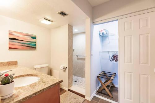 a bathroom with a sink and a shower at Park Shore Resort-1st Floor Condo-Park 101 in Naples