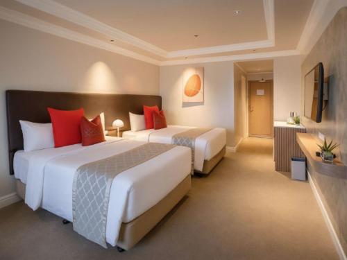 Postel nebo postele na pokoji v ubytování Vermillion Hotel