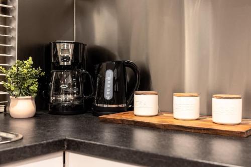 a kitchen counter with a blender on a cutting board at Seednest Barossa Vineyard Escape in Tanunda