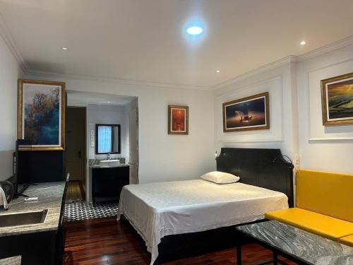 a bedroom with a bed and a sink in it at My Stay Hotel & Apartment in Ho Chi Minh City