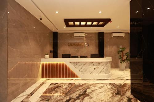 a lobby with a marble counter and a sink at SUMMER88 Boutique Hotel Azara, 4 Km from Airport, Near Kamakhya Temple in Guwahati