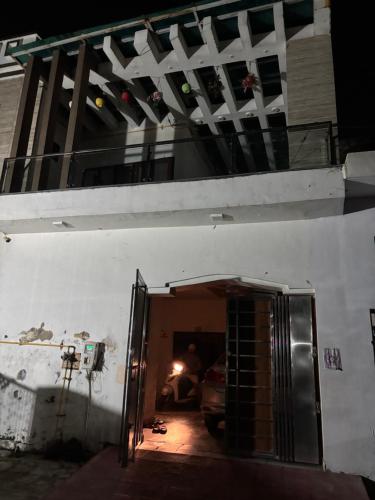 a garage with an open door in a building at B121 kedar nagar in Agra
