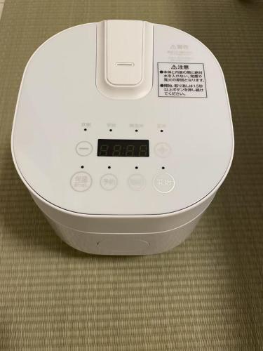a white machine is sitting on the floor at サクラシャドウ銀座502 in Tokyo