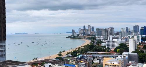 a view of a city with a beach and buildings at Pattaya Beach View Talay 6 by AEGEAN Suite Condo in Pattaya Central